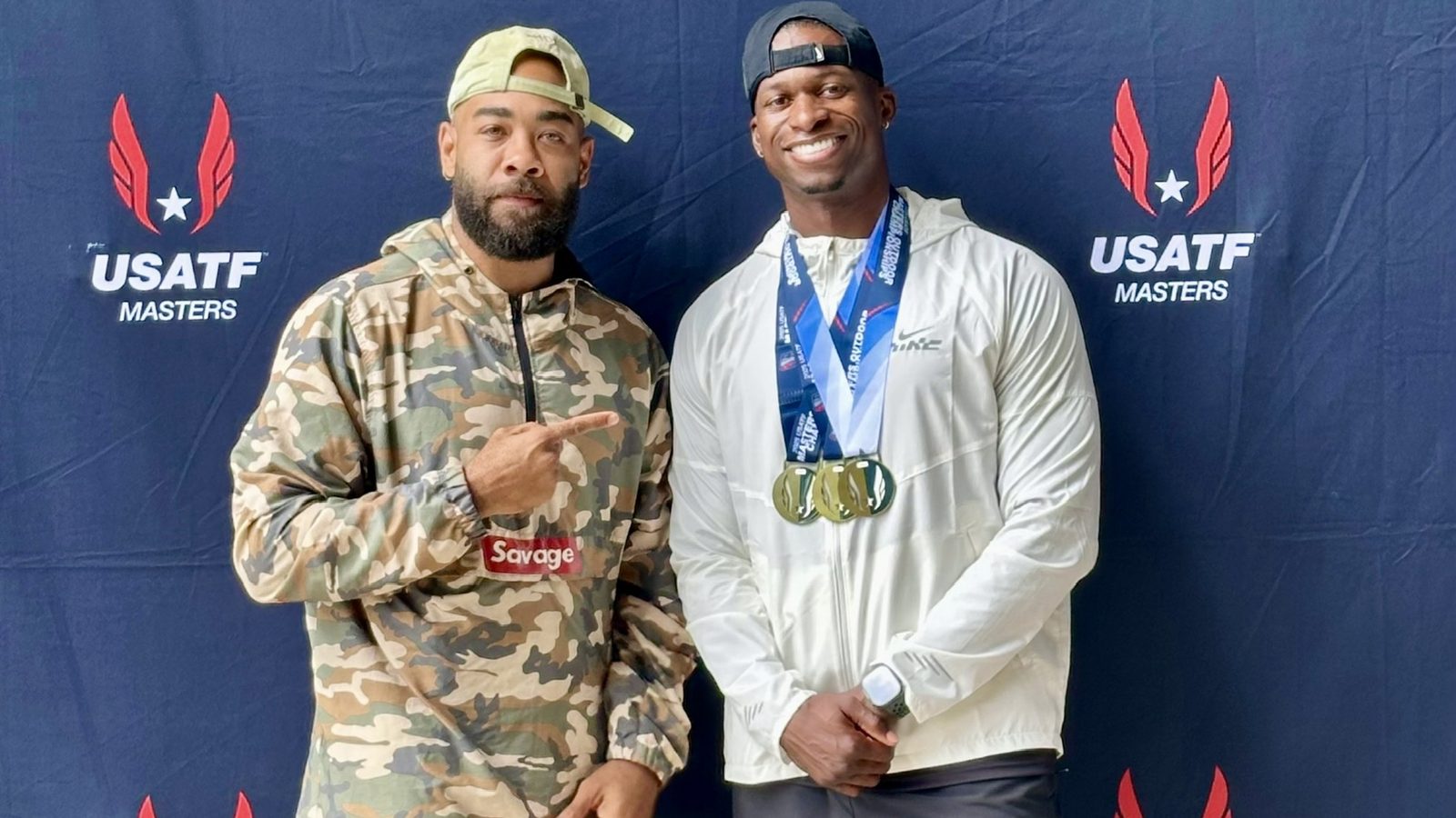 Eric Paige with a medalist athlete at a USATF Masters championship event